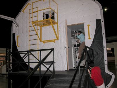 The back way in
I don't know how astronauts got into the real Space Shuttle, but here we entered by the back door, and then up a ladder, as Kathy Lindquist is doing here.
Keywords: Izmir;Space Camp Turkey;Turkey March 2006