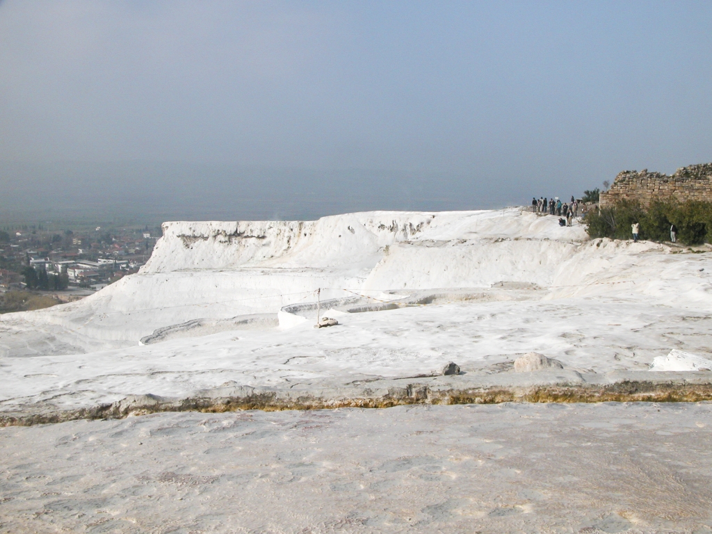 The White Cliffs of Pamukkale
The hot springs located at Pamukkale are the source of mineral-rich water which flows over the cliffs, depositing calcium carbonate which hardens into travertine.
