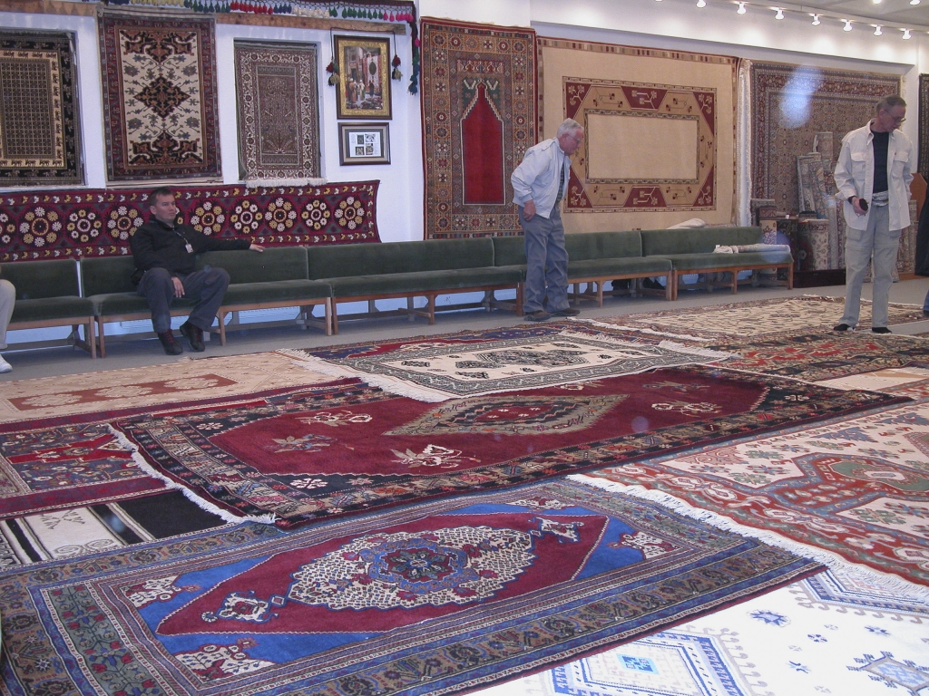 It Rained Turkish Carpets
Chuck Mattox and Marvin Blaski inspect the merchandise while Attila looks on.
