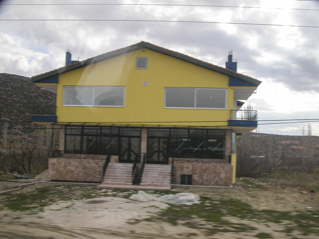 Local Color
This brightly painted structure caught my attention - not sure whether it was a residence or a business establishmen under construction, or both.  (Taken from the bus.)
Keywords: Taurus Mountains;Turkey March 2006