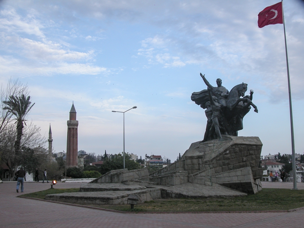 The Ataturk Monument
With two minarets in the background.  The closest, the Yivli (Fluted) Minaret, is Antalya's signature landmark.
