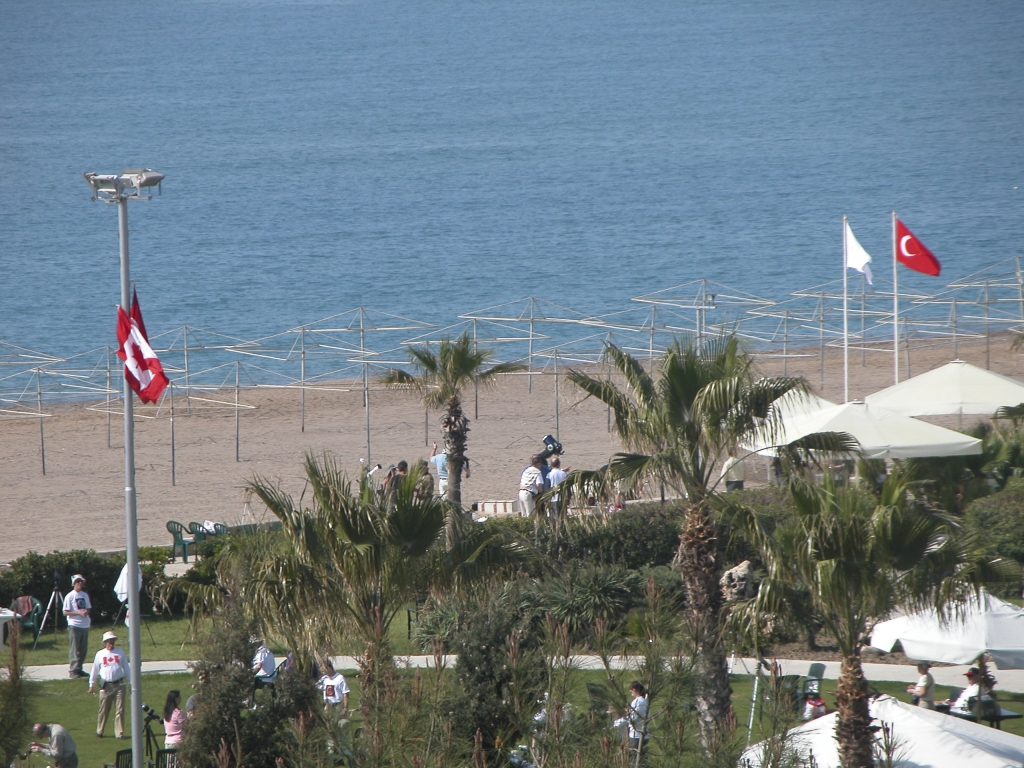 Beachfront
In the summer the beach would have been filled with vacationers under umbrellas (you can see the naked umbrella frames in this picture).  But today there were no beachgoers, just eclipse-chasers, setting up their equipment on the solid ground in back of the hotel.
