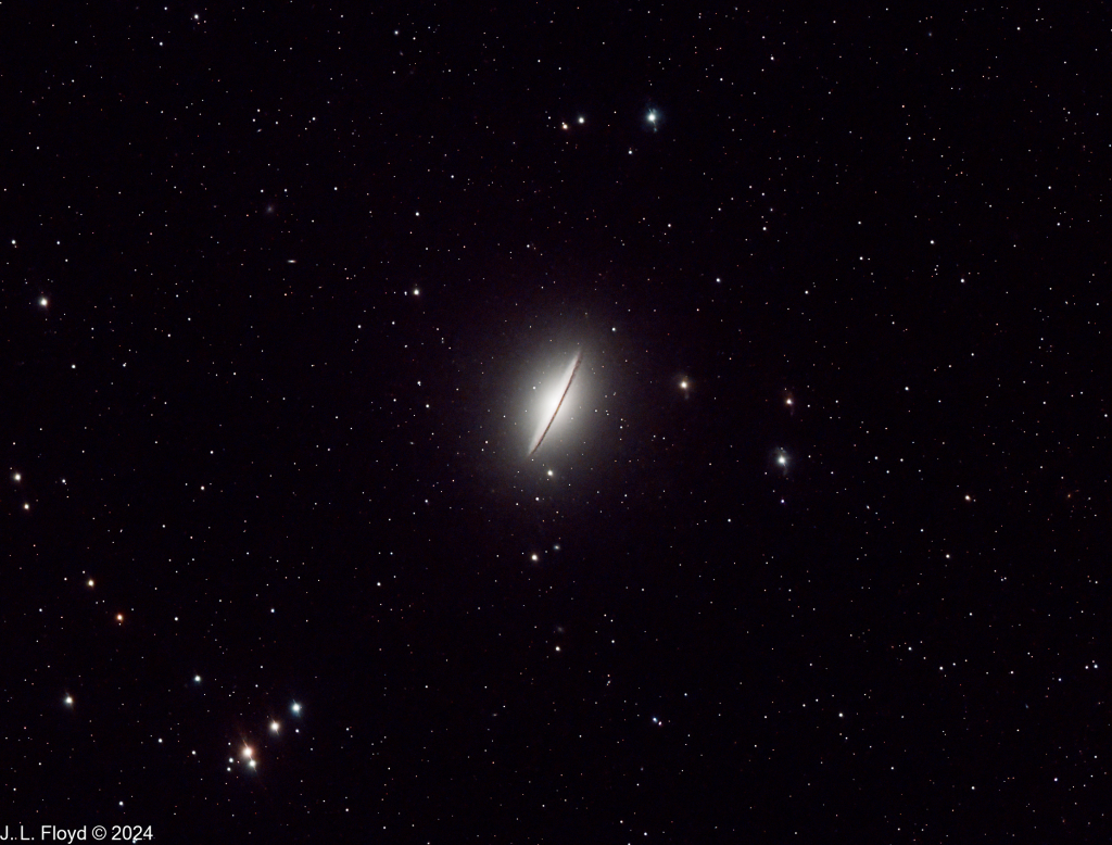 Messier 104 - The Sombrero Galaxy
Unique spiral galaxy 31 million light-years from Earth on the border of the constellations Virgo and Corvus. It has a bright nucleus, an unusually large central bulge, and a prominent dust lane in its outer disk.
