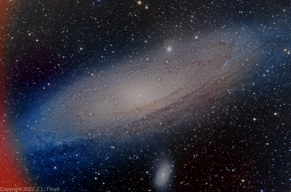 M31 - The Andromeda Galaxy
A wide-field view of the Andromeda Galaxy, 2.5 million light years away and 152,000 light years in diameter.  Satellite galaxies M32 (above right of center, on rim of  M31) and M110 (bottom center) also appear in the frame.  Red swath at left was caused by a reflection of the red power-on light on the ZWO ASI2600MC camera, which sits in front of the telescope.
