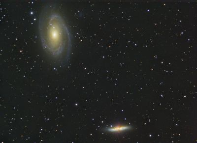 Messier 81 and 82
These two galaxies are found in the constellation Ursa Major and are about 12 million light-years away.  The larger one, M81, is also known as Bode's Nebula; the smaller is known as the Cigar Galaxy, although it's a funny kind of cigar because it looks like it's lit in the center rather than at one end.  Maybe it's an exploding cigar.  Yes - that's it!  It's a starburst galaxy, with an abnormally high rate of star formation in the center!
