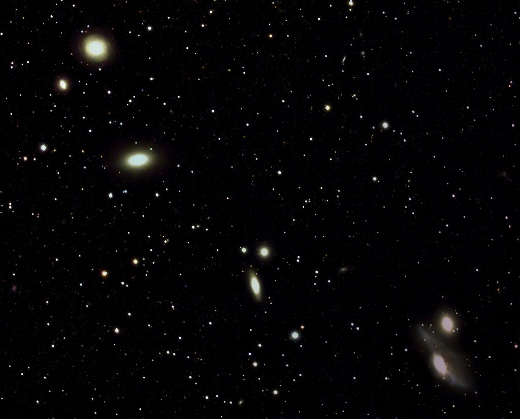 Markarian's Chain
Part of Markarian's Chain, a group of galaxies in the Virgo Cluster.  Visible in the photo are NGCs 4477, 4473, 4461, 4458, 4438 and 4435.  Not  visible are M84 and M86, which are out of the frame to the right - my telescope's field of view is not big enough to capture them all.
