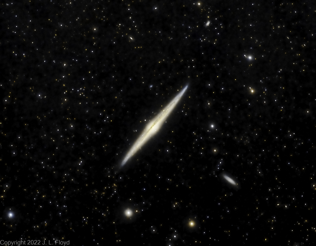 NGC4565 - The Needle Galaxy
Gigantic edge-on spiral galaxy in Coma Berenices, twice as luminous as the Andromeda Galaxy.  40 million light-years from Earth. Satellite galaxy NGC 4562 is shown at lower right.
