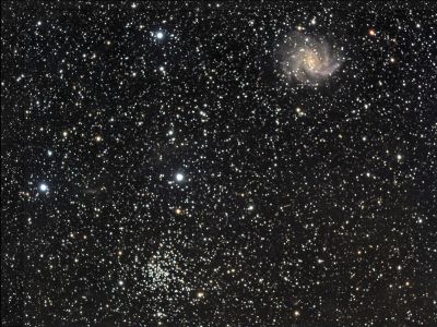 NGC 6946 - Fireworks Galaxy and Friends
An alternate view of the Fireworks Galaxy featuring a neighbor, the open star cluster NGC 6939, near the lower edge of the image.

