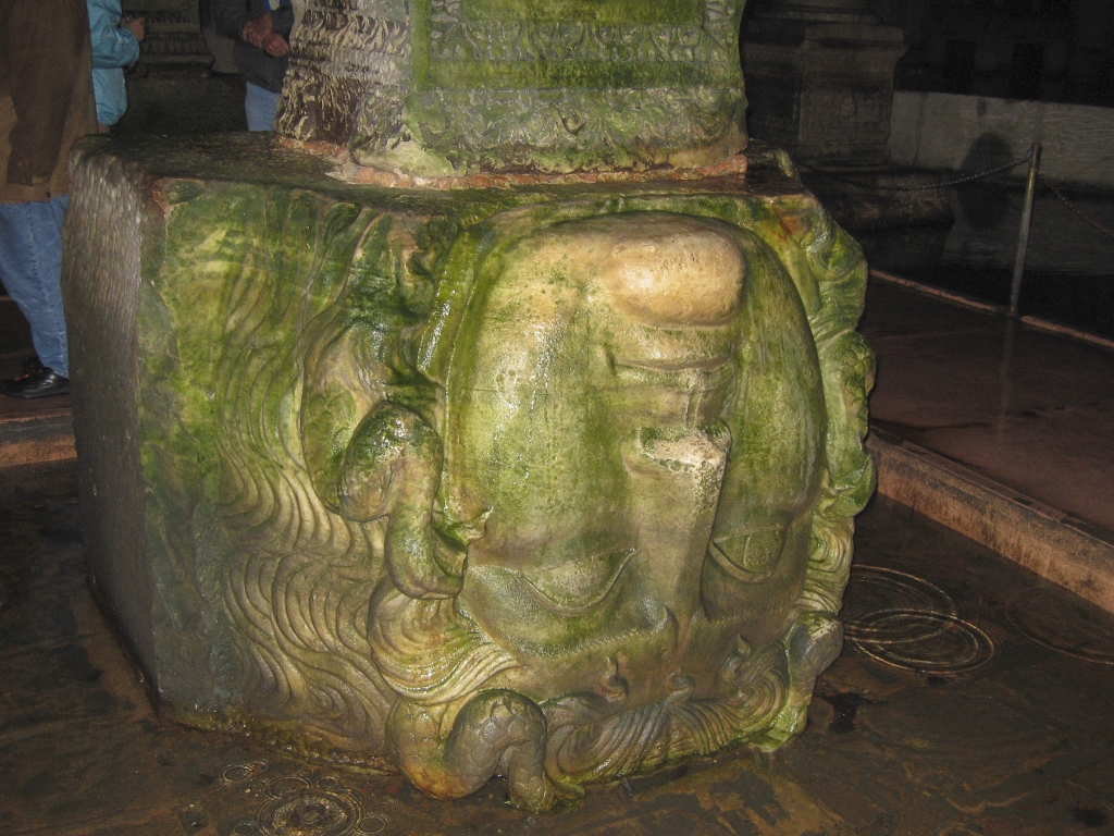 Upside-down Medusa Head
Why is this head placed upside-down?  Legend says that it was to ward off the evil power of the Medusa's gaze, which turned people to stone.  Did people really think that a marble carving could have such powers? Or was there a more practical reason?

