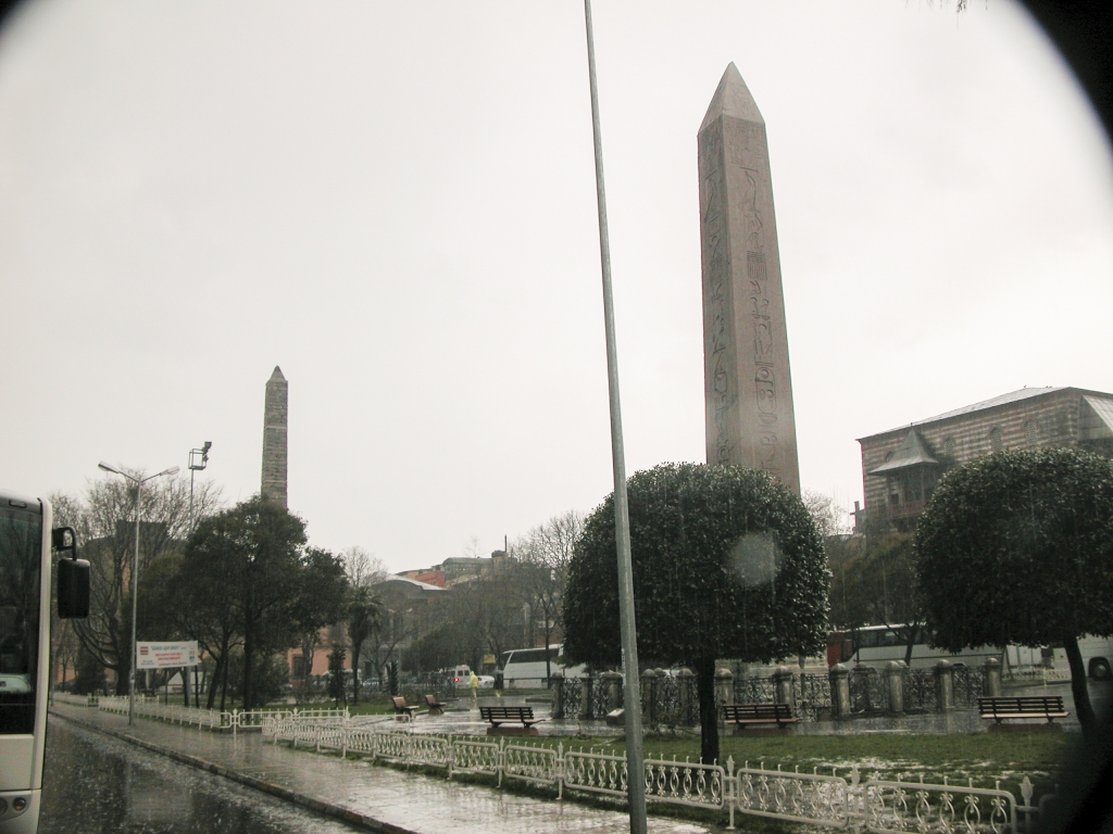 Sultan Ahmet Square
At the end of the square opposite the Obelisk of Theodosius I, seen in the foreground, stands the Walled Obelisk, built in the 10th century by the Byszantine Emperor Constantine Porphyrogenitus.  The Walled Obelisk was originally covered with bronze plaques, but these were plundered by the Latin occupiers during the Fourth Crusade, and now only the stone core remains.
