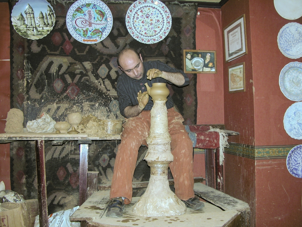 Here's my spout
The potter applies the spout to the body of the teapot.
