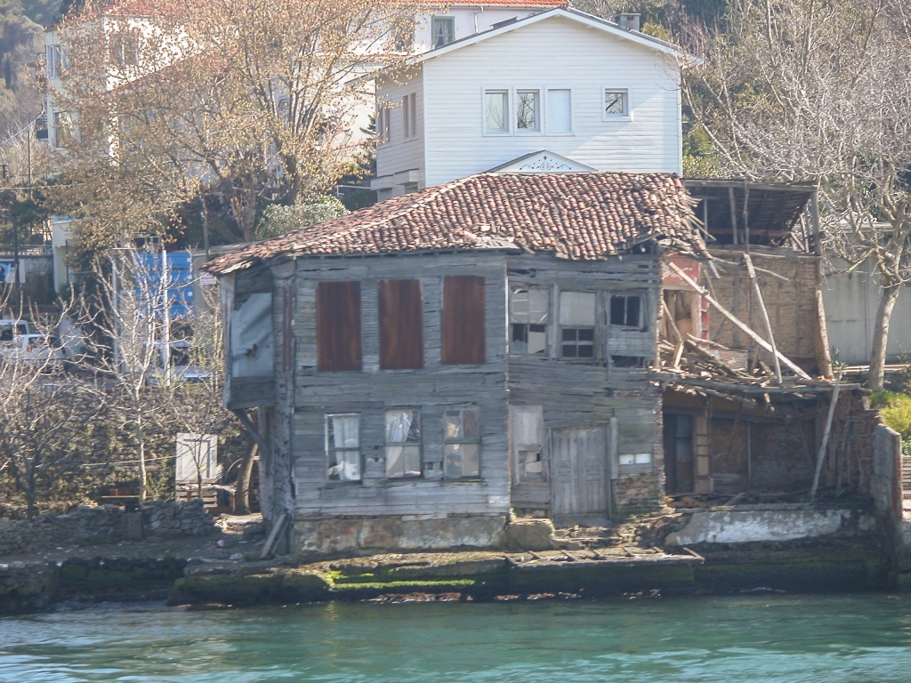Fixer-Upper
An unusual sight in this upper-crust neighborhood - probably an old house in the process of being torn down and replaced with a new one.
