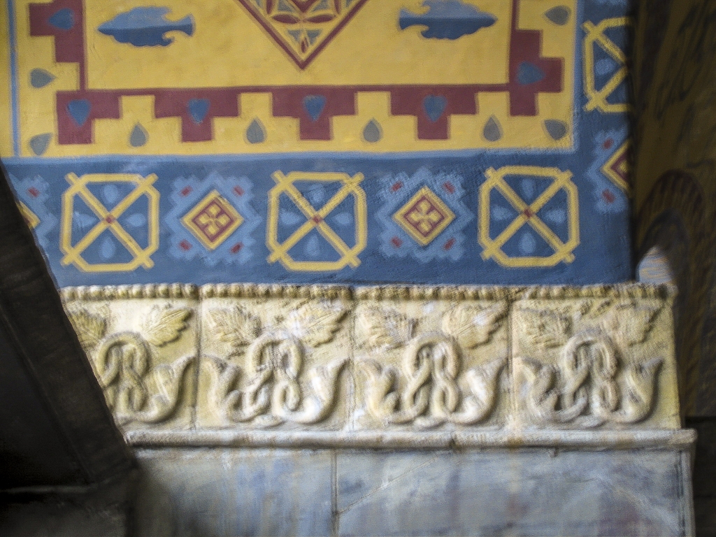 Wall Detail
Colorful abstract figures underpinned by lustrous alabaster reliefs.
