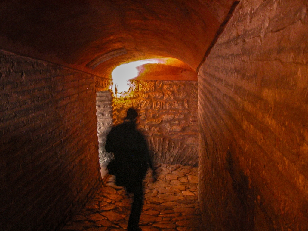 Stone Ramp
The dimly-lit passageway from the upper gallery to the ground floor.
