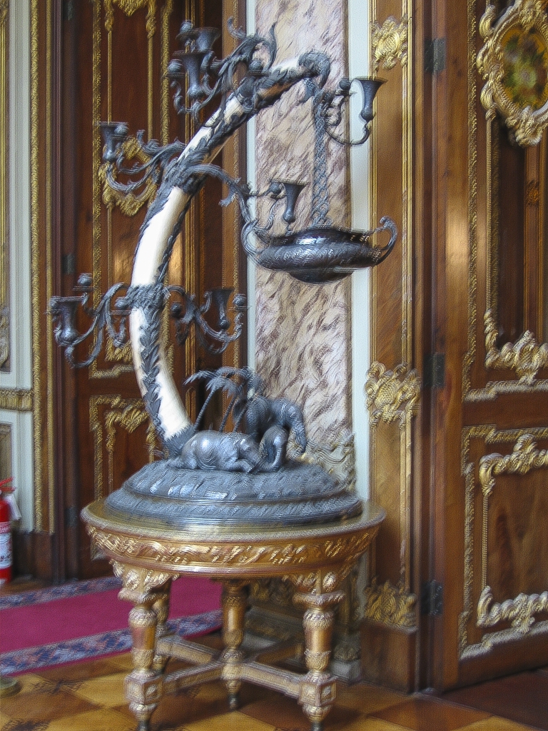 What would you call this piece?
There was nothing to indicate what the vessel suspended from the elephant tusk was intended to contain.  Very imaginative, and very much unacceptable if it were made today, but in the nineteenth century nobody worried about elephants becoming extinct.
