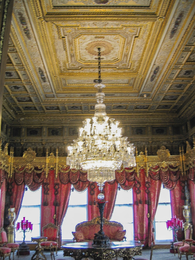 Red Room
The color red predominates in the drapes, wall fabric and furniture, and even appears in the chandelier. Gold leaf is used extensively in the furnishings and ornamentation.

