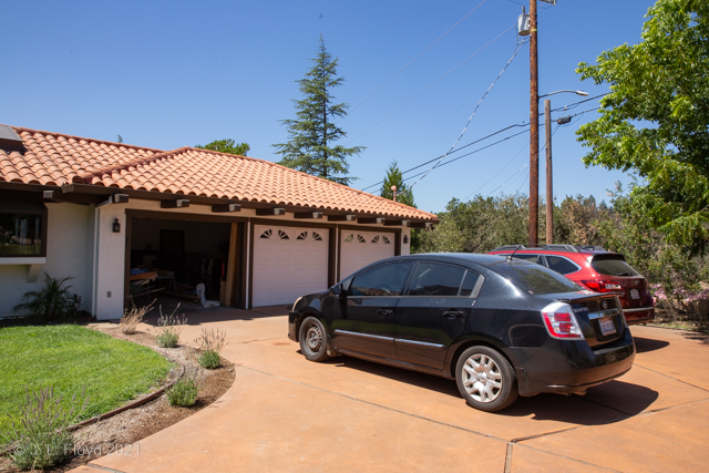 The Garage
The Crestmont house has a three-car garage; Janeta's black Nissan and Sandie's Red Sonja (Subaru Outback) are parked in front.
