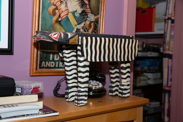 Library zoo
Exotic beasts prowl the library; one of them stalks an old-style telephone.
