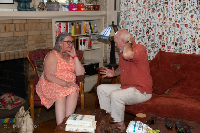 Civilized Conversation
Sandie chats about Beowulf with Doug Rees in the Rees living room.  Note the Tiffany-style stained-glass lamp on the table between them, one of several in the house. 
