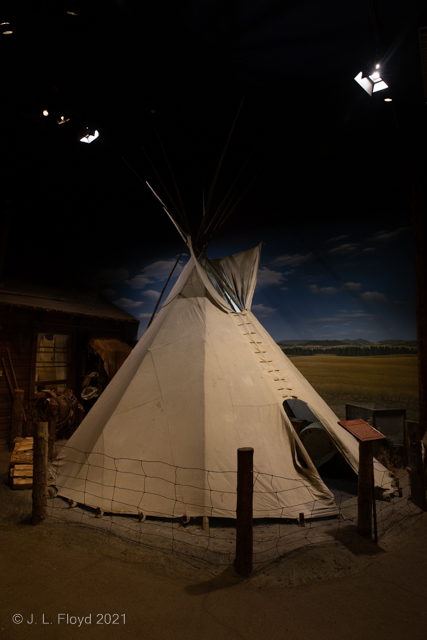 High Desert Housing
A traditional Native American tipi, in front of a regular reservation house of the type that replaced it.
