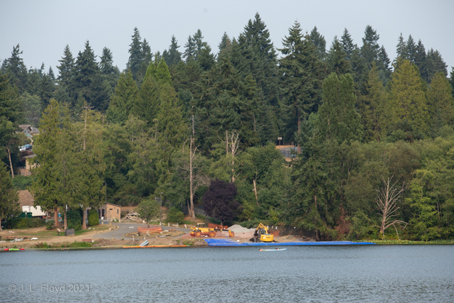 Nile Shrine
I think this telephoto view looks toward the Nile Shrine Golf Course, which occupies the southeastern quadrant of the lake shore.  It's hard to be sure since the view is obscured by trees and construction.
