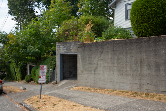 Garage Access
The tiny garage in the last picture is apparently associated with the house on top and accessed from the house via the gate on the left.  It doesn't strike me as a terribly convenient arrangement.
