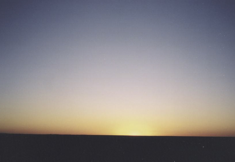 Afterglow
The still-partially-eclipsed sun has just disappeared below the horizon.
