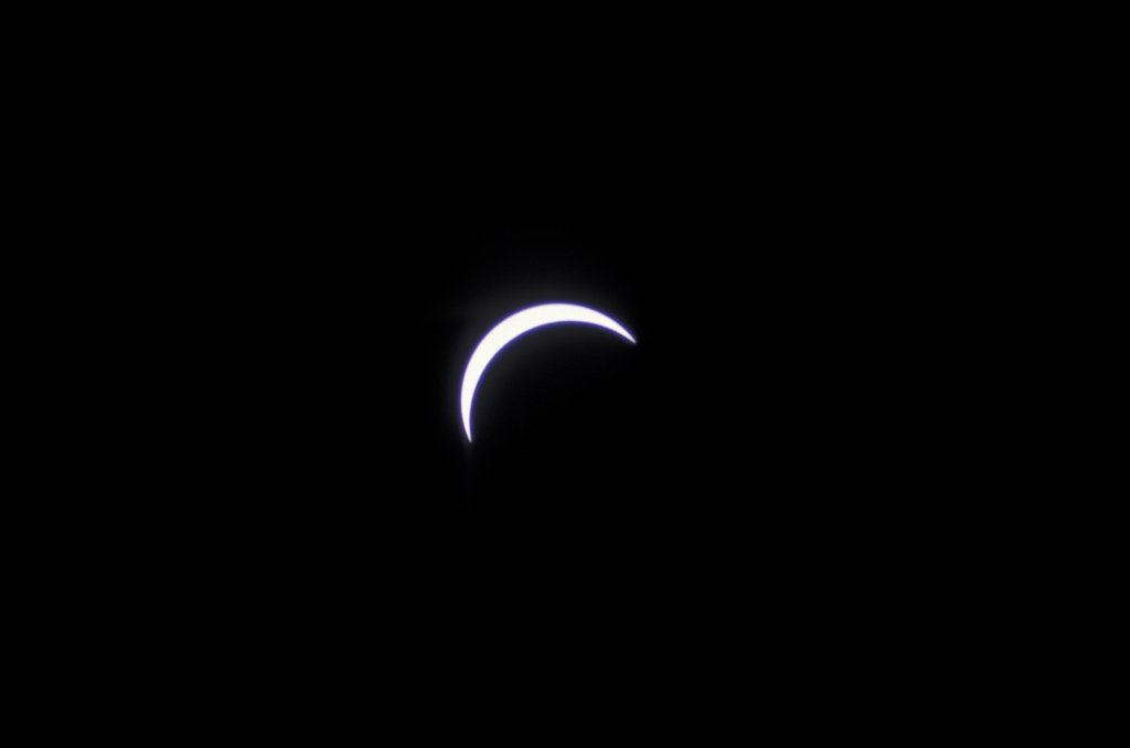 Pre-Totality 8
And over Sicily the air
Still flashing with the landward gulls
And loom and slowly disappear
The sails above the shadowy hulls
