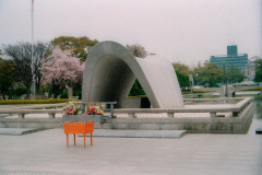 Hiroshima Victims Memorial Cenotaph, with Flame of Peace and Genbaku Dome in background